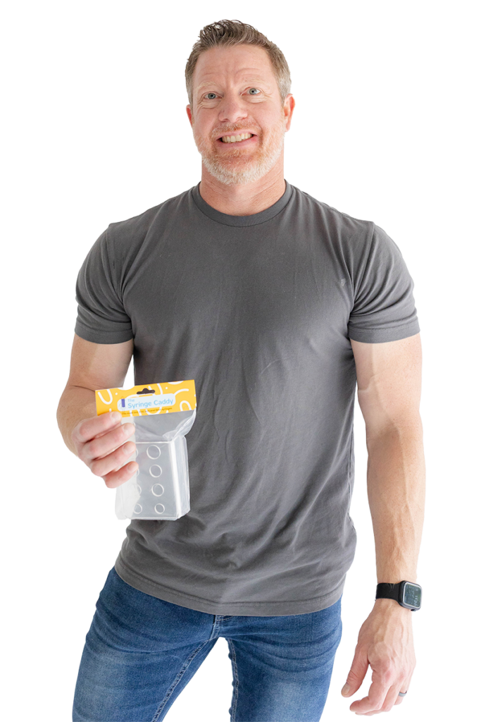 Man holding packaged Syringe Caddy for Medicine Storage and smiling at camera.