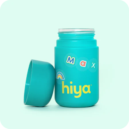Hiya probiotic bottle for children with personalized stickers on teal container, important for family health.
